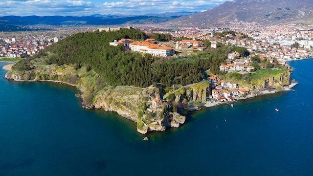 Photo of lake, mountain, and the city of Ohrid